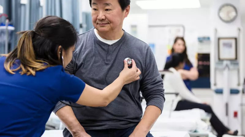 Doctor listening to a patient's chest 