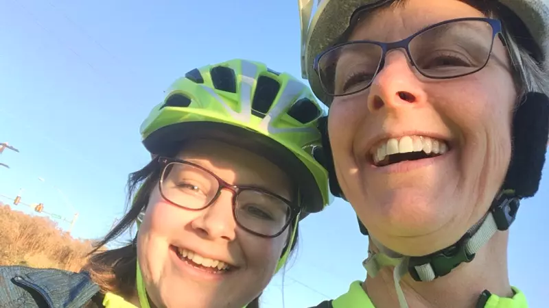 Lea and friend in bright green cycling gear